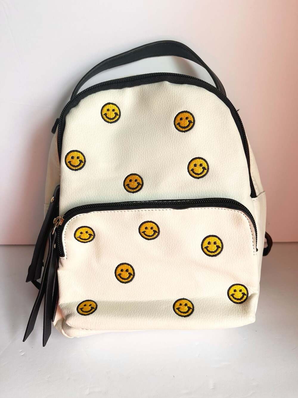 Violet Ray Smiley Face Backpack